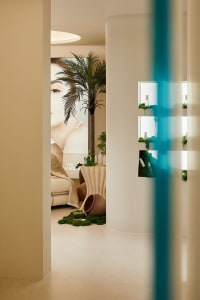 Spa interior with modern concrete design and lush greenery