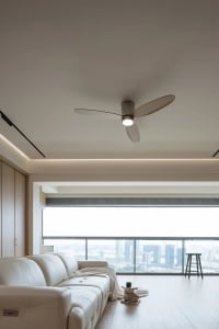 A modern living room featuring neutral-colored furniture and a sleek design.