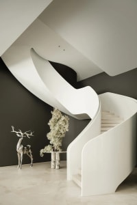 A sleek, modern staircase made of white marble.