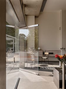 Modern lobby featuring glass walls and concrete elements