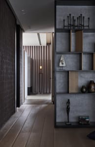 A modern living room with minimalist design, featuring sleek furniture and a monochromatic color palette.