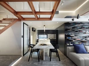 Modern residential kitchen featuring marble countertops and black appliances