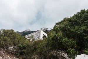 Modern residential home exterior made of stone and cement