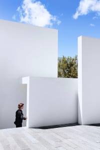 A minimalist exterior wall made of concrete, featuring clean lines and simple design.