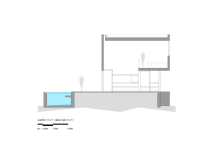 Section of a modern kitchen featuring concrete and glass materials.