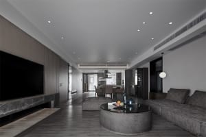 Modern living room featuring concrete and marble materials