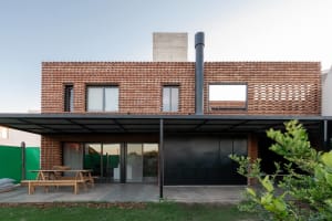 A modern residential building featuring a brick exterior.
