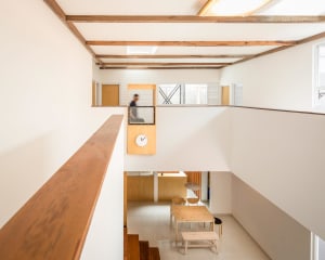 Minimalist living room featuring wood and concrete materials