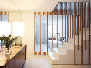 Modern minimalist interior with white space, clean lines, and natural materials.