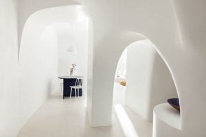 Modern interior space with white walls and concrete floor.