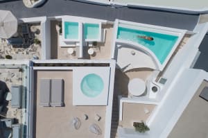 Modern pool terrace featuring concrete tiles and distinct geometric shapes.