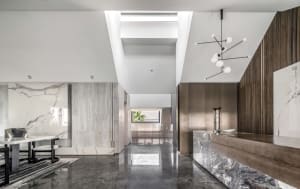 Modern lobby interior with marble, concrete, and wooden elements