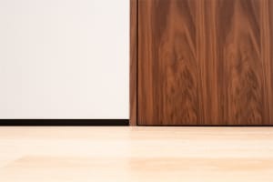 A minimalist interior design featuring wood elements.