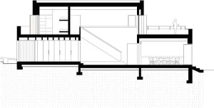 A detailed architectural floor plan in monochrome, showing a two-story residential building with a staircase leading to an up
