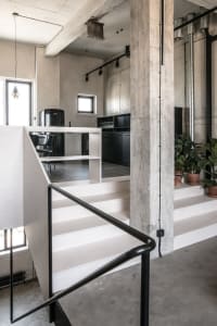 Industrial-style interior design featuring concrete material and minimalist design elements.