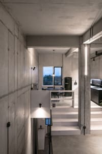 Concrete staircase with modern lighting fixtures