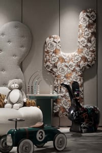 A playful interior design of a children's playroom featuring various toys and furniture.