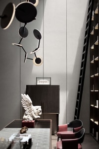 Modern office space with a combination of wooden furniture, glass elements, and leather chairs, featuring a contemporary ligh