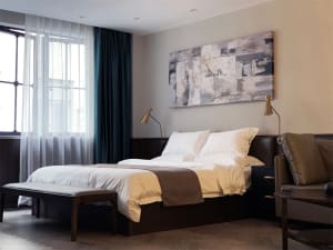A modern bedroom with a brown bed in a minimalist style