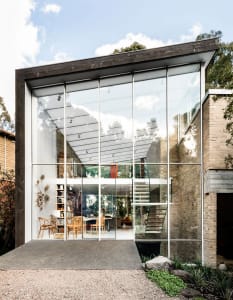 A modern residential extension featuring large glass panels.