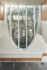 Modern interior design featuring large glass windows