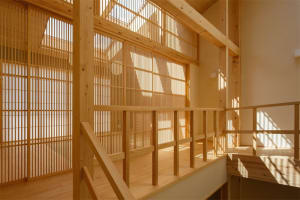 A minimalist residential interior featuring wooden elements.