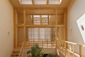 Modern interior space with wooden paneling and natural light.
