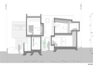 A modern house plan showcasing mixed materials including concrete and glass.