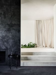 Interior design featuring modern elements like concrete and glass