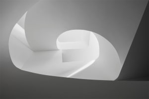A modern white interior with concrete elements.