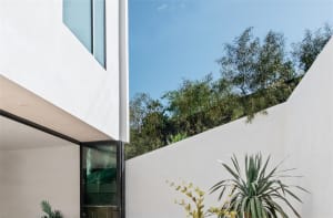 Modern house with concrete and glass exterior.
