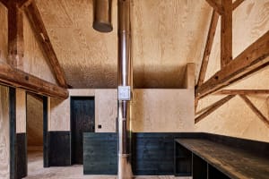 Industrial-style interior space featuring natural wood materials