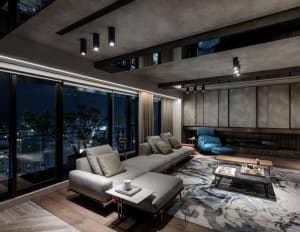 Modern living room with concrete joint tiles and marble accents.