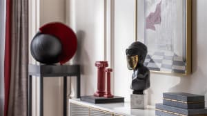 Modern interior decor featuring metal, marble, and glass elements.