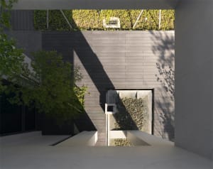 Modern architectural design featuring concrete and glass materials.