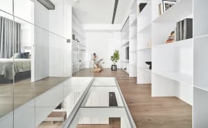 A modern residential interior with a minimalist white palette.
