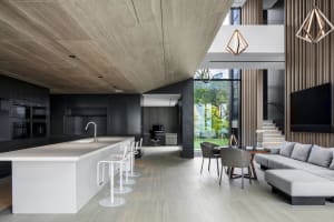 Modern interior with minimalist design featuring exposed concrete ceiling and wall.