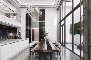 Modern kitchen with marble countertops and white chairs