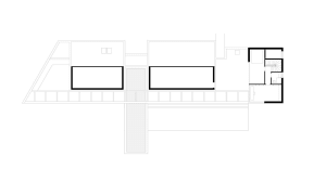 Modern residential floor plan featuring concrete and glass elements.