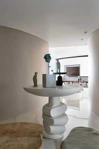 A modern living space with eye-catching sculptural furniture made of concrete.