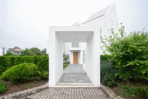Concrete entranceway to a modern residential property.
