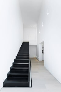 Modern black stairs with white walls interior design