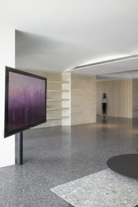 Modern lobby with a terrazzo floor, minimalist design, and contemporary decor.