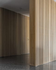 Modern office interior featuring wooden panel walls