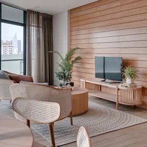 A modern living room featuring a wooden interior design.