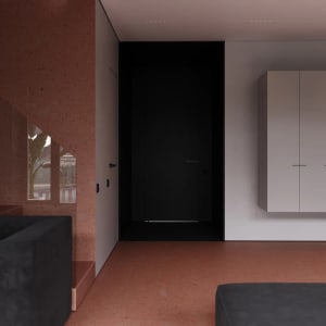 Modern minimalist bedroom featuring white concrete walls and floor, with black door and furniture accents.