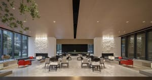 Modern hotel lobby with marble flooring, contemporary furniture, and minimalist design.