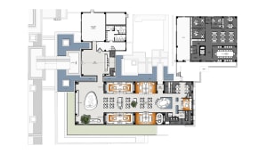 Floor plan of an office space with various functional zones and furniture arrangements.