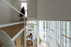A modern residential interior featuring a combination of wooden and metallic elements.