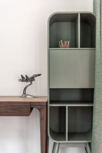 Modern minimalist desk and shelving unit made of wood.
